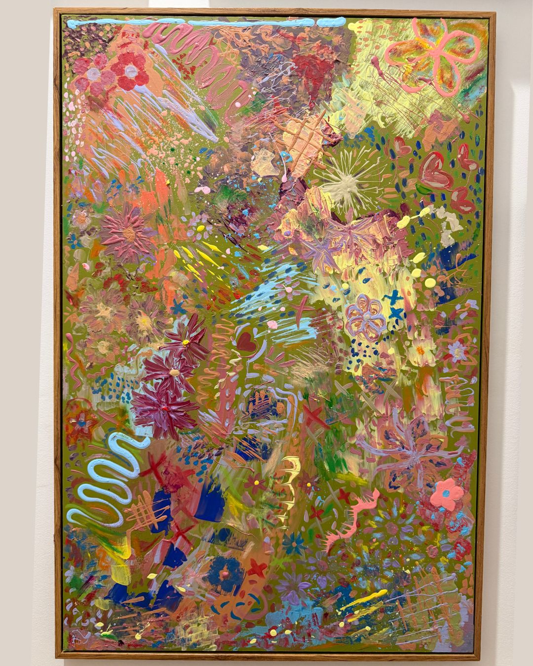 colourful abstract art painting with floral and green on white wall