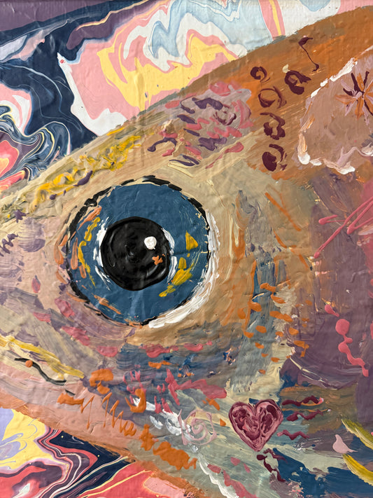 Artistic depiction of a fish eye with colorful abstract patterns
