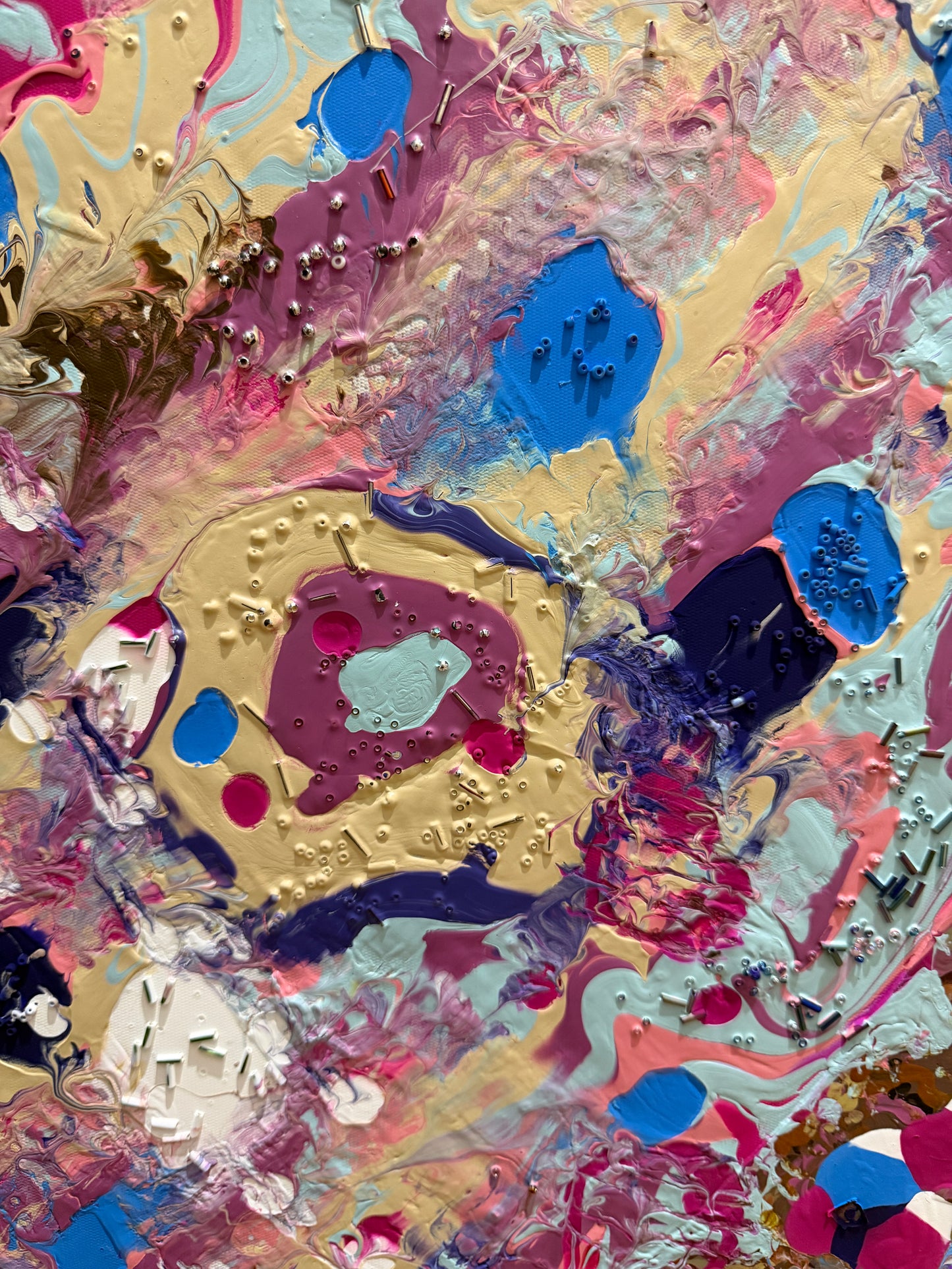 Abstract art with a mix of colors and textures beaded