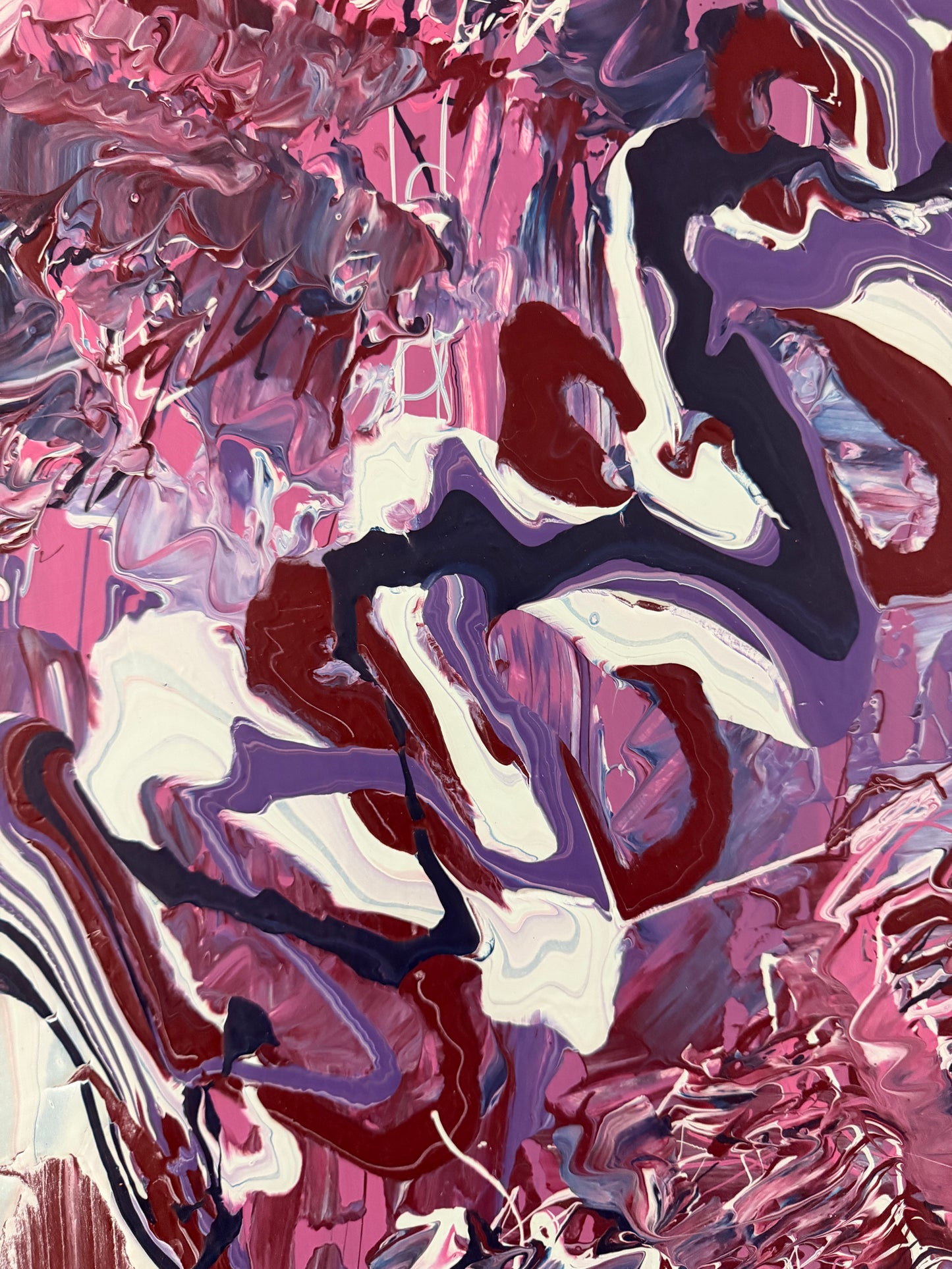 Abstract art with swirling pink, red, and white colors
